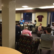 A group of students gather in a residence hall